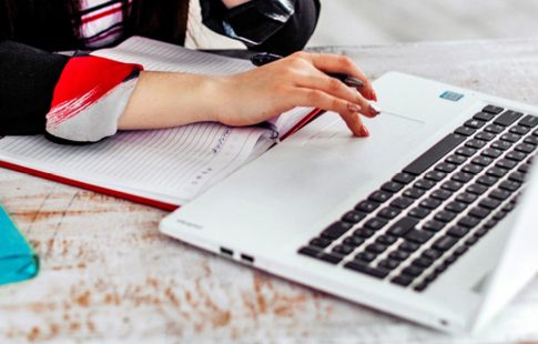 Woman searching online on a laptop