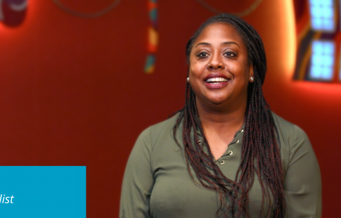 Wanuka discussing Black History Month. There's a Great Place to Work logo in the upper right corner of her picture and text in a blue box in the lower left corner: Wanuka Barrett, Sr. Learning Specialist