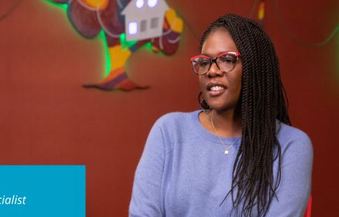 Deastina discussing Black History Month. There's a Great Place to Work logo in the upper right corner of her picture and text in a blue box in the lower left corner: Wanuka Barrett, Sr. Compliance Specialist