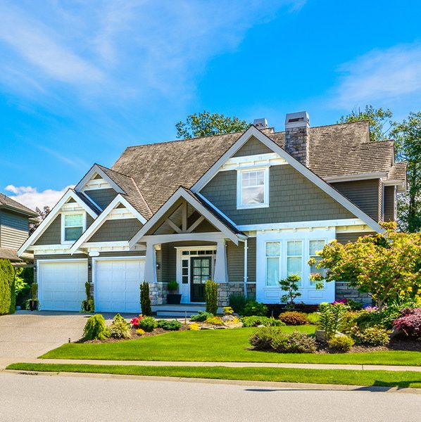 Row of homes with well-manicured front yards. This is the featured image for the blog "Credit Scores Rise: 6 Benefits of Good Credit When Buying a House or Refinancing"
