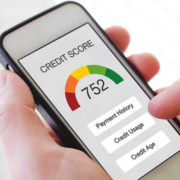 Man’s hand holding a smartphone showing a credit score. He is about to select an option below the score that says “Credit Usage.”