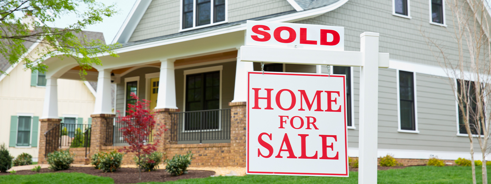 House with a sold sign in the yard. Read on for tips on how to win a bidding war on a house.